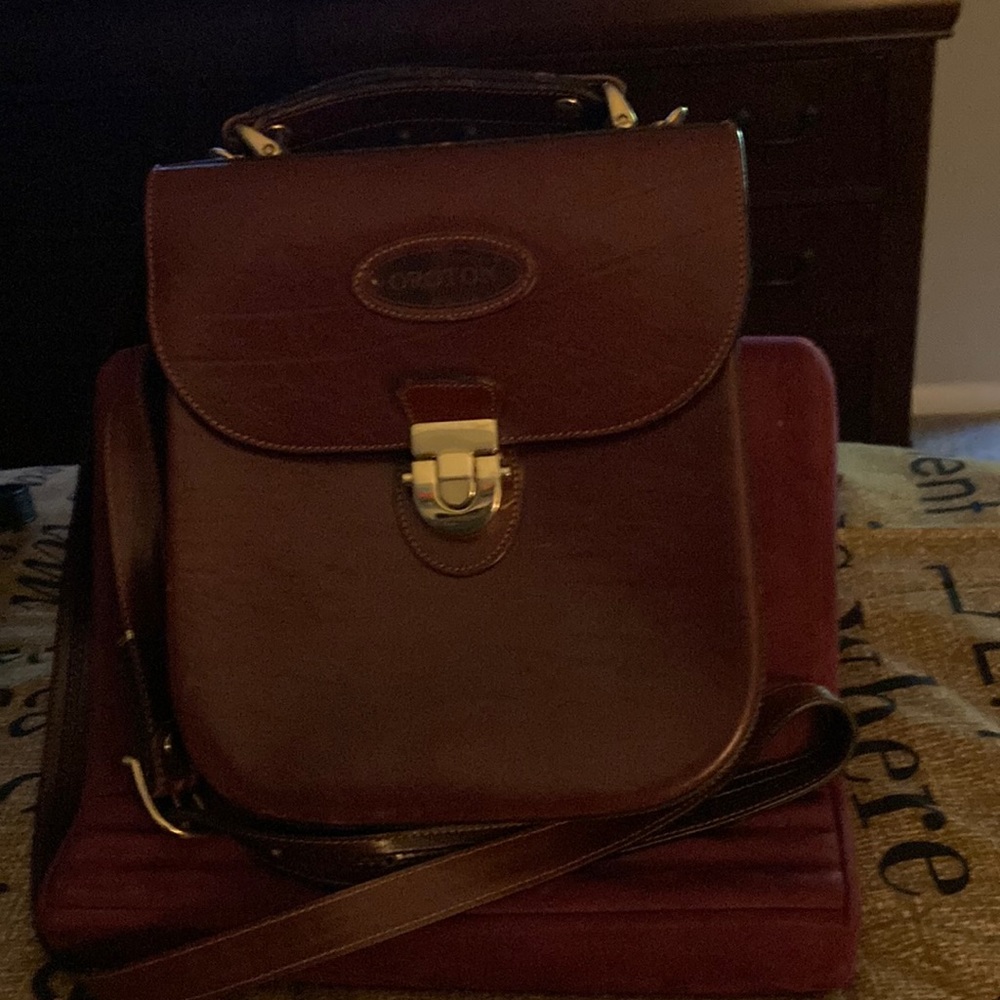 Brown OROTON designer handbag. 9 1/2 vertical by 8 1/2 wide.